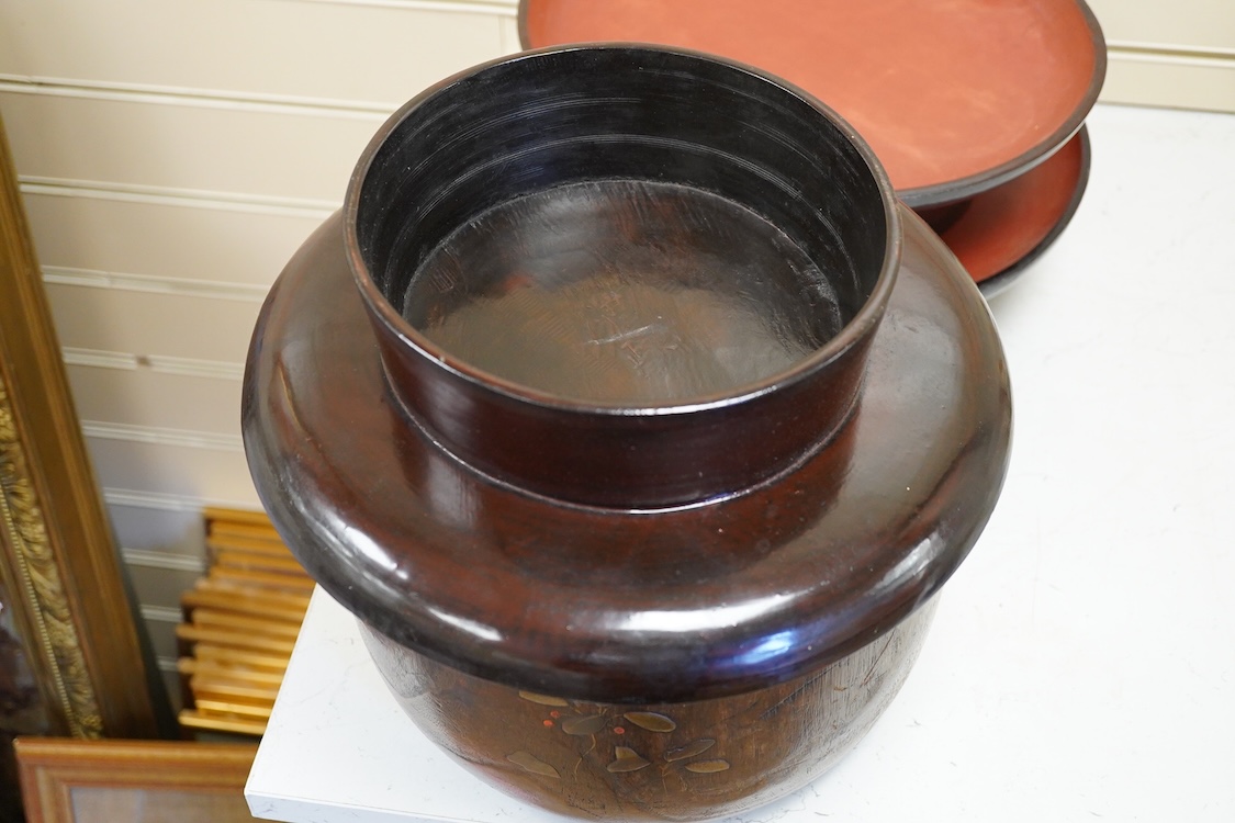 A Japanese lacquered paulownia wood hibachi, 20.5cm high and three Burmese lacquer stands